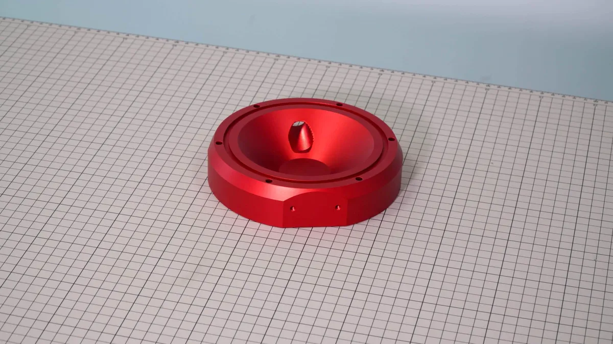 A red anodized machined aluminum component